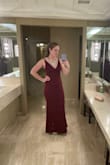 Ive always shied away from mermaid style dresses because I'm self conscious about my inverted hip shape but decided to go outside my comfort zone and try this dress. I LOVE IT! I wore Spanx shorts under to smooth out a bit and am amazed how this dress looks on me. The fabric is stretchy but thick so it smooths out a lot. I do think I should have gone a medium instead of a small for a little more room but I took the do not remove tag off accidentally, oops. I wore it to my mom's holiday party and was getting compliments all night. I want to get this dress in a couple more colors, it's great! I'm 5'6" and wore it with 4" heels but I could have gotten away with wearing a shorter heel and still not had to hem. - Lizzy G.