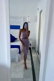 I wore this dress SO many times this past summer because it was my absolute favorite! I got so many compliments on this dress cut and lavender color. The slit is high enough my legs looked so long, but the slit wasn't too high or showing too much. And the fact I didn't need to wear a bra was a huge plus. A must-buy! - Serin W.