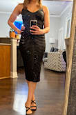 I ordered a large and a medium in this dress. I decided to keep the medium as it hugged my curves better. The large had a little bit more breathing and wiggle room. The dress was comfortable and I did not have to keep adjusting myself through the evening. Received many compliments. - Helen N.