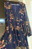 The dress is super cute and super flattering but the sleeves!!! They are LONG, orangutan long, dress is currently at the alteration shop getting the sleeves altered. Obvi I like the dress enough to spend more to have it fixed but if they could have just made "normal" length it'd of been perfect. - Wendy A.