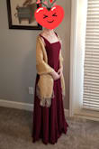 I bought this to be a bridesmaid dress for a friend's wedding - it is such a lovely dress! The color leans more bluish than reddish as far as burgundy shades go (which is what I wanted but may not be for everyone). The straps are faux-tied which provides better security since I don't have to worry about them coming untied as much. I did have to shorten the straps a little, but I doubt that most people will need to do that. - Amanda N.