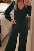 This jumpsuit was super cute on & perfect color for Christmas Party!  I loved the fit everywhere.  The only issue I had was length - I'm 5'3" & even in my tallest heel it still wanted to drag the floor - so I will get it hemmed but it's worth it to me.  I ordered a size small.  5'3" & weight is 125lbs - Kellie M.