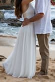 This dress was perfect for our beach wedding! It hangs beautifully and has pretty details at the top. I had to get it altered a little bit and taken in on the sides and hemmed at the bottom as it was a bit long and a bit wide around my upper body. The adjustable straps were also nice and that helped with the fitting. I tried on several dresses from Lulus but this one was perfect. An added bonus was that I didn't have to worry too much about it getting wrinkled in my luggage. I also loved that it didn't have a slit in the bottom and it was still flowy. Perfect for a beach wedding! It even survived a swim in the ocean. - Linnea B.