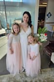 This fit perfectly, I'm a 4 or 5 and the S fit well. There is room for a strapless bra or some push-up but I wore pasties under it. Shoulder straps are adjustable. It was beautiful at my small wedding. I steamed it and wrinkles came out easily. I am 5'5" I wore flats and it was a bit long so be conscious of that if you need to hem it. - Kerry S.