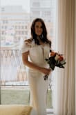 I did have to get it hemmed for length because I am on the shorter side but this dress fooled people into thinking I spent thousands. Paired beautifully with a veil. Super dreamy and romantic! - Lauren R.
