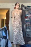 This dress is perfect! High quality and so flattering. It's nice and thick so you don't have to worry about anything showing through. Since it is a little heavy, I would recommend tying a knot on the first loop once you adjust the chest to a level you are comfortable with. - Kasie G.