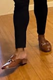 I bought my mother a great pair of Ranae Brown Crocodile-Embossed Slide-On Loafers (Brown). My mom loves loafer and mule-style shoes which caught my attention online. She wears a size, but I ordered a size 7.5 because I was afraid they would be too small at size 7. The size 7.5 for her perfectly. The leather and crocodile material she especially loves and left my mom with a smile on her face for Christmas! Thanks - M.Rucker - Marlon R.