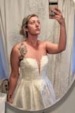 I needed a wedding dress last minute and ordered this dress in a size 10. My boobs aren't that big compared to my chest and waist size, so I thought the small sizing in the bodice that others have noted would be ok. I got into the dress but the bra area was hard to zip up. I ultimately decided to go with something else and returned this dress, but would recommend it for anyone else wanting a ball gown on a budget. Note, I edited my photos to show more of the detailing in the bodice. It's very subtle irl. - Brittany D.
