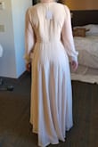 Ordered as a potential reception dress for my wedding. The medium was too narrow in the shoulders and too tight in the waist. I returned it for a size L. The first photo is size M. Second is size L. - Brittany D.