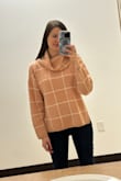 This sweater is much larger than I expected. I knew it was an extreme oversized look, but I ordered an XS and it could totally pass as a L. The cowl neck is also HUGE. I bought it final sale, so I couldn't return, but decided to keep it (vs giving it away). it's very soft and definitely comfortable. Sleeves are a little short, considering how big the rest of it is. Color os more of a pale peach than a pink. But still a decent sweater - especially since I got it on super sale. - Tori R.
