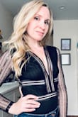 I love this bodysuit, no bra needed and it's sexy without being too revealing (I'm only a 34AA however so I think that helps). No stretch but it does fit true to size, I ordered the Small. I haven't experienced the rips as others have mentioned but I was super careful taking it on and off as I had read the reviews. - Erin A.