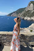 I wore this in Italy on a hot day and it was perfect! The slit is really high so I would recommend shorts or a bathing suit underneath. The fabric is super breathable, no bra is needed, and it's tall girl approved! - Angela B.