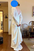 I loved everything about this dress - it is simple, elegant, has just enough train. I was worried the material would be itchy - definitely not the case. The only thing "wrong" was I felt the shoulders were a little loose and could easily slip off - nothing a little tailoring couldn't fix! The shoulders do have a bit of non-slip material to make sure they do stay in place once fitted right. The picture looks a little long, but once I put shoes on, it was just the right length. This would have been my wedding dress - but I ended up trying one at a bridal boutique and fell even more in love with it than this one. - Johnna B.