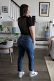 Such a flattering top. I love how flirty this top is. The back and waist is totally shear but the breast portion is thick enough that I don't feel exposed at all. I feel like it accentuates all the right places. - Nicole U.