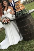 This dress was my dream come true. I did ordered a size 8 first and it was a little small on me , I sized up to a size 10 and was just perfect. I looked at hundreds of dresses and as soon I came across this dress my search was done . Loved it , it looked just like a bridal boutique dress. - Yudeisy C.