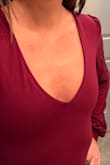I got an XS and I love love love this bodysuit. I am petite all around and this fits great. It is quite low-cut on me so if I wanted to wear this to work I would probably wear a cami underneath. For what it is worth, my actual bra size is 28D but that isn't an option when choosing my Lulus fit details. My husband's eyes lit up in a good way when he saw how low-cut it is. I don't even have cleavage but had a push-up bra on so there was a little va-va-voom. I have a shorter torso than normal so it's not a struggle to snap the crotch closures, but there also isn't extra fabric. It's a really nice fit. I like the sleeves because they're not poofy or billowing, more droopy, but it's a nice touch. Sorry for the sideways picture. Tried rotating it before uploading and this site for some reason wants it to be horizontal. - Rachel H.