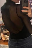 I love this body suit so much. I bought a second one because I want to keep wearing it for a long time and have back-up. You can dress it up or down. It's so versatile. I've worn it 4 times and after the last wear it started fraying a bit at the seams between the sheer and non-sheer part. I think the material is a bit delicate and maybe I shouldn't have danced in it where I was moving my arms a lot. I wear it with a backless, adhesive bra, which surprisingly stayed in place- usually if I am dancing/sweating at all, the sweat causes the bra to slip down a bit with other tops, but since the bodysuit is fitted, it holds the bra in place so perfectly, and I don't think it makes my boobs look weird. I get so many compliments every time I wear it. It's sexy but classy. I think it looks nice with high-waisted jeans or skirt. - Nathalie E.