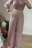The pants can be worn, high waisted or lowered pants are long if worn lower will drag the ground the pants are lined and are not see-through
The top, however, it's not lined and is see-through in the sun, which will be fine for a bathing suit cover-up you can wear on the shoulders, or off the shoulders will show not much skin on the belly on the shoulders. Of course, exposes more skin...The pants can be worn separately with a different top to dress it up would make it fun to go to a casual restaurant. - Julia K.