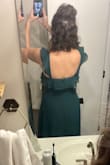 After many dress try-ons I finally ordered this one and immediately knew it was a winner! It is light weight, good quality, fits true to size minus maybe a little tiny bit big in the straps (but not enough to alter). I love it! It's elegant looking with a little sass from the slit. The bride absolutely adored it! The waist wasn't too tight in my rib cage area and the length was perfect with my heels on! I would absolutely recommend! No bra needed for me either! - Hanna J.