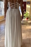 Gorgeous dress that makes you feel like a princess! Love the flow of the skirt and the openness of the top, especially the back. Unfortunately because its so long( and Im not !) it would cost quite a bit to shorten and I had easier options to go with so didnt keep this one. Btw, in the pictures, Im standing on a stool - Tammy N.