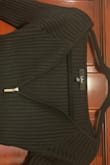 This top doesn't have the deep v photographed on the model. It has a kind of reverse sweetheart neckline that I dislike. The flaps of the neckline roll down upon trying on. This item is not returnable. I wish it was, Id never keep it! Going to goodwill. - Naomi R.