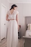 I bought this set knowing I would likely not wear the top, but wanted this skirt for my wedding ceremony. The only reason I did not give this 5 stars is because the top runs a bit short under the bust. The skirt is very romantic and the slit is not too dramatic, but makes it easy to walk in. It just hits the floor in 4 inch heels and that is how I want it. Be cautious about sizing. I bought a xs because I am a 25 waist, it fits, but it just nearly fits. The zipper went all the way up, but no wiggle room. I like the "sash" style at the very top. It is a good transition for whatever top you're wearing with it. Cropped or not. The back of the top is very elegant. I really did like how it zipped all the way up the back. Nice lace detailing and scalloped edges, too. - Kiana G.