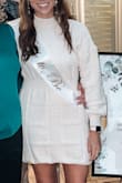 I wore this to our couples shower and it was a hit!! The fabric is thick and cozy. It hugs you in all the right places and the open back completes it. I would buy it again - Ashlynne R.
