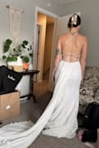 I ended up returning this one, but it is nice quality and really pretty! I love the lace-up back. The train seemed a little weird to me and almost tail-like, lol. The material is pretty stiff and was uncomfortable and difficult to move in. I am 5'3" and it would definitely need to be hemmed. - Carlie W.