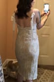 I saw on the reviews that it ran a little big so I sized to an XS and it fits perfectly! The material is very well made and perfect for my after dress for my destination wedding in New Orleans! (I didnt tie the bows right so dont judge!) - Camille D.