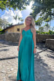 I wore this to a destination wedding in the Dominican Republic on a mountain top and it was PERFECT. So flowy, so beautiful in the wind. I find that most of Lulus dresses run a bit big, so I almost always size down & have them hemmed. The small fit perfectly after hemming. I have a small chest & big hips, for reference. - Kaity A.