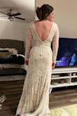 This was is beautiful and fits great. The fabric beneath the lace is a nude color so it didn't seem as bridal to me which is what I was going for. - Amy B.