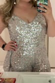 I ordered this romper for a 70's disco-themed birthday party and it was an absolute hit! I have long legs and a full chest, and I didn't feel this was too short or exposed too much of my chest. It's definitely booby, don't get me wrong, but it was at a level I was comfortable with. I typically wear a 12 or 14 in dresses, and I ordered an XL in the romper and it was perfect.
Two things to consider when you're ordering are:
1. If your thighs touch while walking, some of the sequins will tug and fall off.
2. I'm fair with somewhat sensitive skin. The sequins rubbed my inner thighs and the insides of my arms, so I ended up with a little rash on my arms and thighs. Honestly, for one night I was fine with it, but it's something worth noting if you have sensitive skin or have sensitivities to certain textures/fabrics. - Kate P.