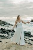 After ordering 4 wedding dresses this is the one I kept putting on and felt the most comfortable in. The material is seriously such great quality minus a few threads here and there. It's flattering up top but did become a little loose after working out before our elopement. The bottom of the dress is my favorite part. It was the perfect amount of flowy for a simple beach ceremony. My fiancé helped me add ribbon as straps so I felt a little more comfortable in the chest area. So happy I chose this one. - Maddie G.