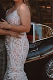 I bought this dress to wear for my engagement photos and it was perfect. Downside: The straps are elastic so there was not much support for larger chests, I fixed this with a supportive strapless. The belly band was a tad snug but overall fits true to size. - Cortney H.