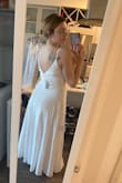This will snatch your waist! Beautiful dress, very elegant. You can see the pockets thru the dress fabric but very easy to have it altered. - Jasmine H.