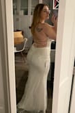 This dress is very pretty but just didn't feel like it flattered my body type. Felt a little short in the front on me. - Jasmine H.