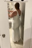 This dress fit nicely on my top half, but I had issue once it got to my hips. Luckily the fabric on this dress is a little stretchy. It also seemed somewhat see-through around my curvy areas? Another reason I didn't choose this dress is because it was super short on me for some reason which I thought was odd since I'm only 5'6". I did return this because it wasn't THE dress. - Ashley S.
