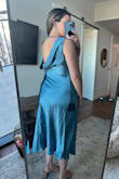 Love this dress and it's so flattering on and the color is amazing. The material is nice and thick satin. My one complaint is that it has a lot of static cling and needs a good steam. Otherwise it's a 10/10!! Perfect for a wedding guest dress. - Sydney B.