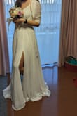 The dress is exactly like in the pics! Super cute, elegant, simple but yet so beautiful! The cute tiny belt looks very classy. I am 66kg, 1.73cm tall, 90cm bust, 66cm waist, and 95 cm hips. I need to wear 6-7cm heels, otherwise, the dress touches a bit the floor  The size 6 fits me perfectly! The strings in the back can be very nicely adjusted. The dress is already padded so you don't even need a bra. Fully recommend! It came from the US to Japan in less than a week! Super impressive! Beautifully and carefully packed. The only thing it needs is some professional dry cleaning. - Gabriela C.