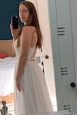 You can adjust the straps of the dress using the lacing in the back which is another detail which adds to the beauty of this already magnificent dress. I feel right at home in this dress even though I bought it thinking it's was pretty different than my usual style. - Tahlia H.