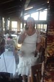 I loved this dress for my bridal shower! It has zero stretch so I felt it fit very snugly but I wasn't uncomfortable.   I did have to have the sleeves fixed as they were enormous! - Melissa L.