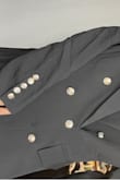 It was very disappointing. Material, in general, is not good quality. Buttons are shiny and look really bad. - Adriana M.