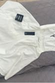The dress is too loose. Another order was made for size Small. Dress has the tags and never been worn. - Erika C.