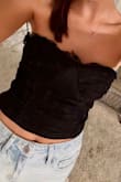 Loved this! I'm flat chested so I did have to use two-sided tape to keep it up, & I'm usually an xs but I'm so glad I got a s. There is no zipper or button so you have to pull it over your head. It's comfortable material:) - Emma B.