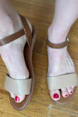 This was my go-to sandal all last summer, looks fancy enough for a nice night out but casual enough for the beach. I always had to be a little conscious of scraping up the front edge, and like other reviewers, eventually that weird internal piece of metal started just sticking out randomly one day. But it was after several months of use, and well, you buy cheap sandals, you get what you expect. Anyway I bought them again so clearly I think theyre still a good value. Photos show one of my old sandals with the metal sticking out and one of my brand new ones :)

My feet are like 8.5-9 Wide, and the size 9 was just right. - Christine L.