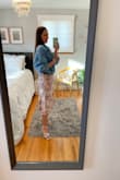 This dress is fun, flirty & flattering. It ties in the back so you can adjust the straps to your bust and waist (help will be required). The material is light & airy, it flows when you walk & the floral color scheme is lovely & easy to accessorize with. The midi length hits just right & my toddler can climb all over me & I'll still feel secure. It has this retro Italian glam vibe to it which I love! See how I styled it @thestylestrudel - Sonja B.