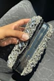 The bag is very nice but it gets stuck when opened, the glitters are removed and in the end, my bag broke. - Dayana M.