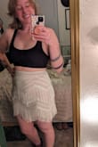 I bought this dress for a Taylor Swift concert this summer! I can't wait to rock it with some tall boots. The fabric has a small amount of give to it. I ordered a medium because it was the last one available. I would normally go for a large, but hoped for the best! It just barely fit but I was still able to try it on and fall in love with it! The details are beautiful and the sequins sparkle a little more than in pictures which is awesome!  It is slightly see-through so choose what you wear under it wisely! I love that it's a two-piece so I can wear the top with some shorts or the bottoms with a cute bralette! The only thing I noticed was that the zipper doesn't lay quite flat in the back which isn't a huge deal, the fringe makes it less noticeable with the movement. Overall super fun dress and I can't wait to see how many ways I can wear it! - Mary E.