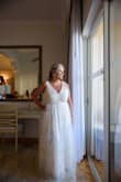 I picked this dress before we even had a venue because it looked good in every size and I could picture it on the beach, in the mountains, or in the backyard! Needed alterations to shoulders for lift and added cups. The strap alterations really helped the waist from bunching. It is sooo comfortable I can wear it all day long in Mexico no problem. Can't wait to see it with my hair and makeup actually done!!  UPDATE:  I didn't wear the cups my seamstress added... and now I regret it.  It would have made a big difference in the photos.  I machine-washed it and hung dry because the bottom was filthy after a long day outside.  It came out perfectly. - Kathleen W.