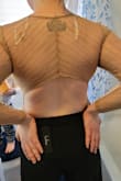 I bought this to just try and see but omg this is so hot. I'm buying it in every color. The fit is perfect (and I have a long torso) holds the girls in but shows off just enough. I'm stunned by this tbh. (Sry about the sweatpants I was sick when it came in but just HAD to try it on) - Julie C.
